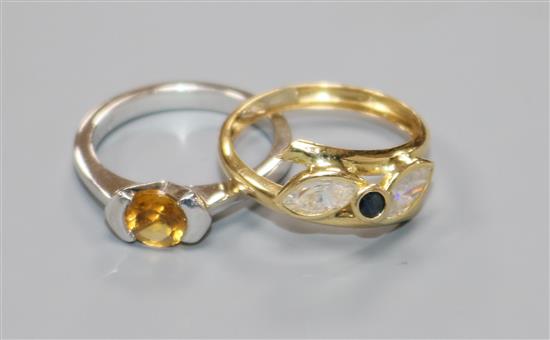 A modern 18ct white gold and citrine ring and an Italian 18ct gold ring.